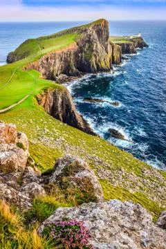 Vertical view of neist point lighthouse and rocky ocean coastline, scotland Stock Photos