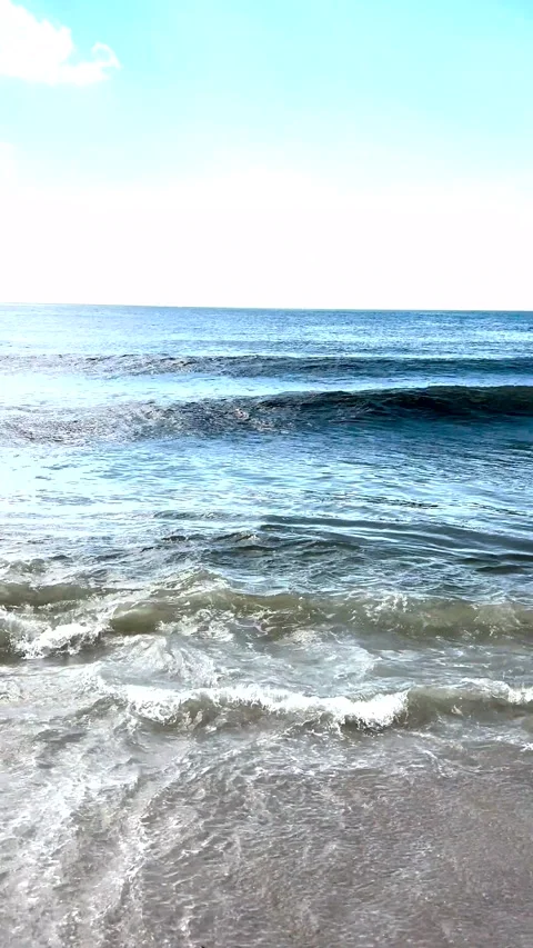 Vertical View of Ocean Waves Rolling On to the Shore of Fire Island Stock Footage 344913782