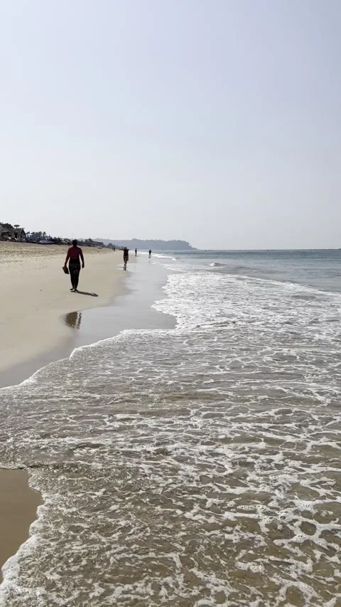 Vertical view of ocean waves splashing on sandy shoreline Calangute Beach Goa 스톡 동영상 343134029