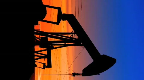Vertical view of oil donkeys at sunset Stock Footage