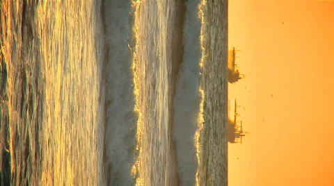 Vertical view of oil tankers at sunset Stock Footage