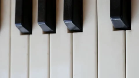 Vertical View Of Old And Dusty Electronic Synthesizer Keys Close Up. Panning Dol Stock Footage 143569231