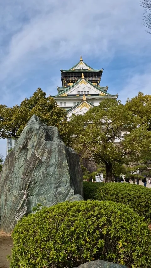 Vertical View, Osaka Temple Behind Park Trees in Spring Season, Japan Stock Footage 337997095