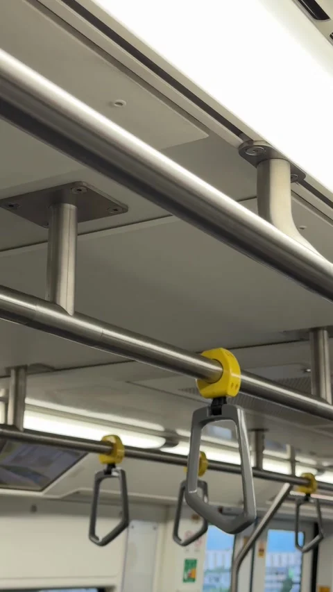 Vertical View Of Overhead Hand Grab Ring Swaying Inside Moving Skytrain Carriage Stock Footage 346596863
