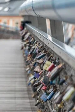 Vertical view of the padlocks in the Kladka Ojca Bernatka bridge in Poland, K Stock Photos