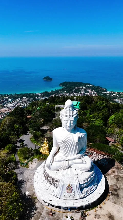 Vertical view of Phuket Big Buddha with sea in background – Thailand 4K Stock Footage 325079069