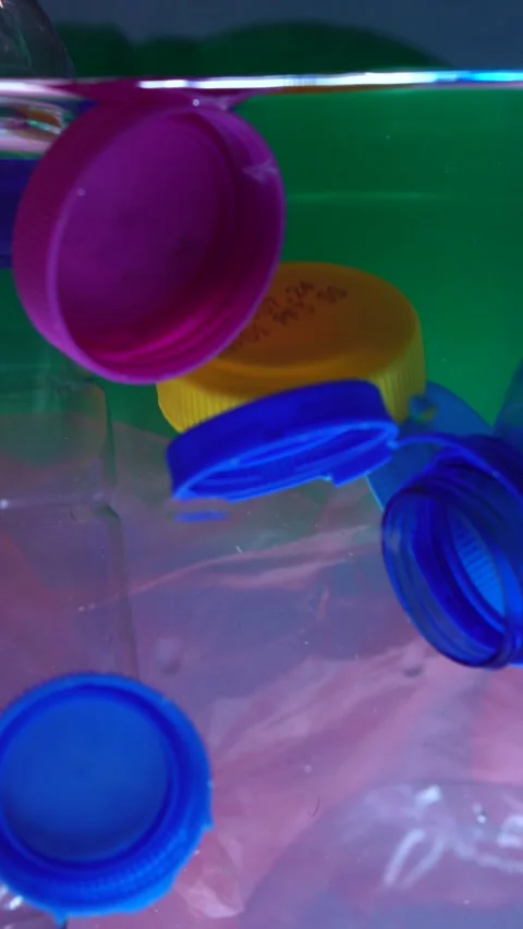 Vertical View, Plastic Bottles and Caps in Water, Microplastic Pollution Stock Footage 289763937