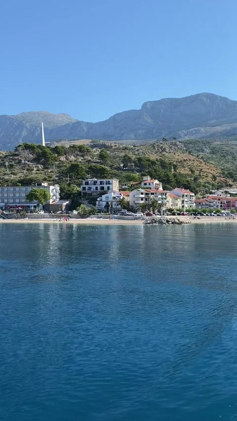Vertical - View Of Podgora Town And Biokovo Mountains From Boat In Croatia Stock Footage 345278005
