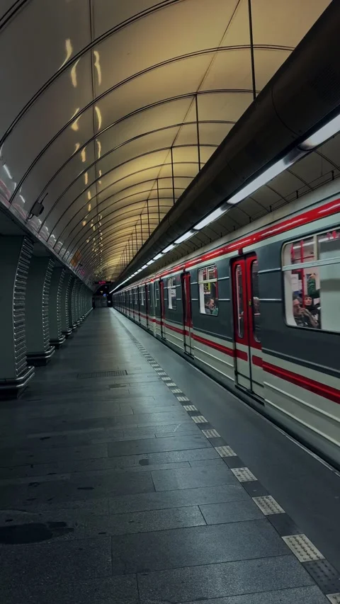 Vertical view of a Prague Metro train quickly departing from an underground Stock Footage 342342240