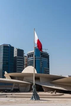 Vertical view of the Qatari national flag flying at the National Museum of Qatar Stock Photos