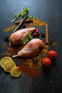Vertical view of raw meat with vegetables and spices and condiments Stock Photos