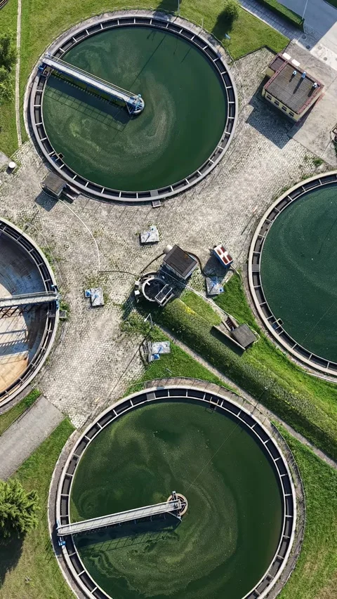 Vertical view. Recycled water storage tanks in environmental facility Video stock 348631091