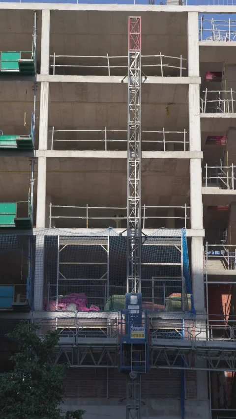 Vertical View of Residential Building Under Construction with Concrete Structure Stock Footage 336012074
