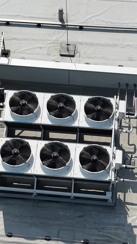 Vertical view. Rooftop air conditioning chillers and solar panels on industrial Video stock 348630908