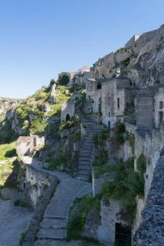 Vertical View of the Sassi of Matera on Blue Sky Background. Matera, South of Фото