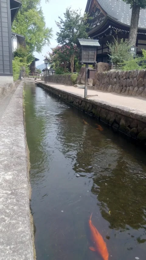 Vertical View of Seto River Canal and Stone Wall Stock Footage 346649392