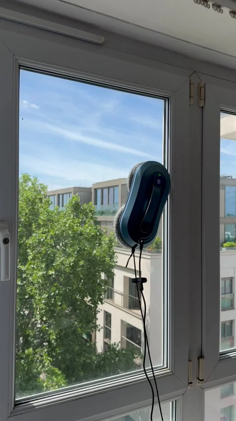 Vertical view from side of professional worker cleaning window pane Stock Footage 336907264