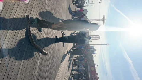 Vertical view. Snakes owners offer tourists to take photos at Coney island. Stock Footage 241933606