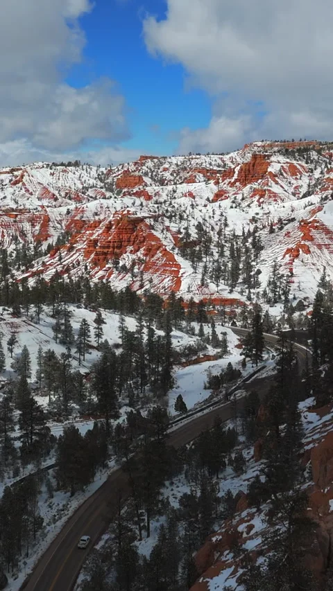 Vertical View Of Snow-Covered Red Rock Mountains In Utah, United States. Aerial Video stock 312801266