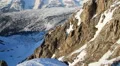 Vertical view of snowy mountain ridge with glacier on top, Alps HD Footage
