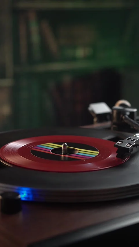 Vertical View, Spinning Red 45 RPM Vinyl Record, Playing Music in Home Stock Footage 323364810