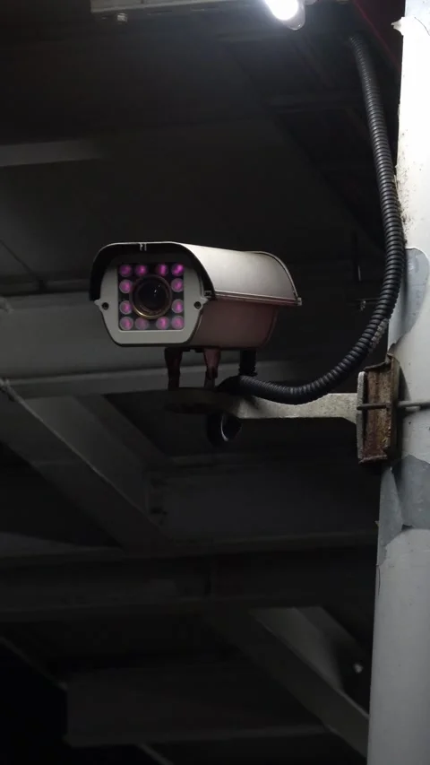 Vertical view of a surveillance camera on a train station platform. Stock Footage 327640874