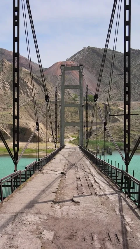 Vertical View of Suspension Bridge Over Naryn River in Kyrgyzstan Stock Footage 337832951