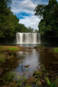 Vertical View of Tad Champee Waterfall with River and Lush Jungle in Laos Stock Photos