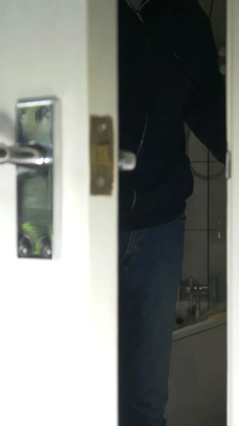 Vertical - View through a room door to a man exiting the bathroom opposite. Vídeos de archivo 280228134