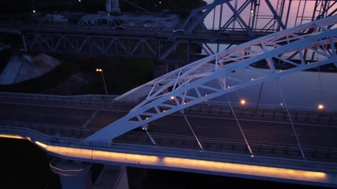 Vertical view from top down. Flying over the road bridge in the late evenin.. Stock Footage 299846298