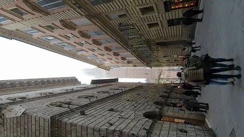 Vertical view of the Torre del Mangia in the middle of the palaces in 4k Stock Footage 103419182