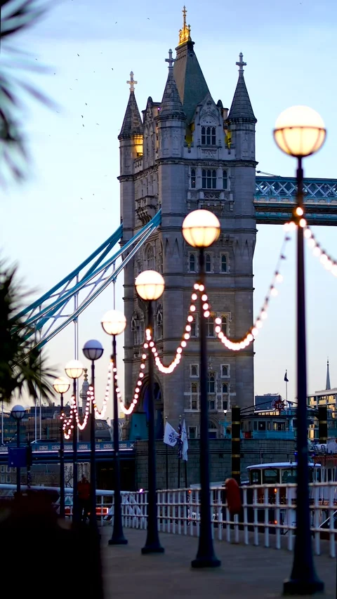 Vertical view of a Tower Bridge, a world-famous symbol of London crossing the Stock Footage 144325059