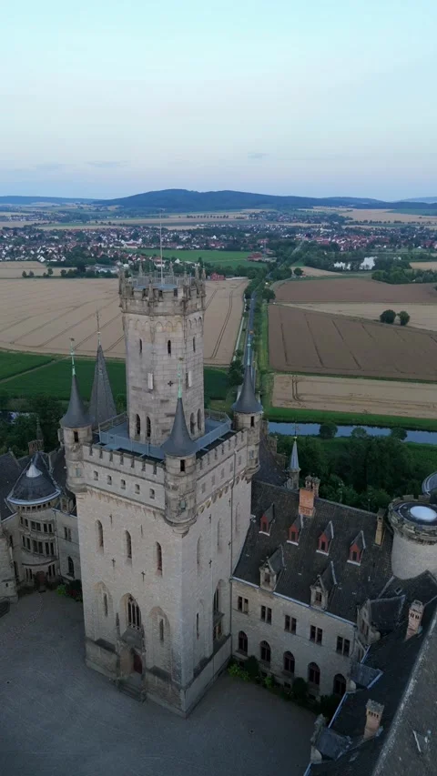 Vertical view of the tower of Marienburg Castle above countryside Stockbeeldmateriaal 340160040