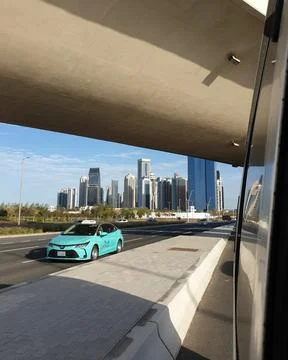 Vertical view of a turquoise green colored Karwa taxi  Stock Photos