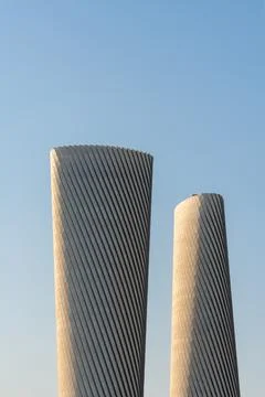 Vertical view of the twisted high-tech facade of the Lusail Plaza Towers. Stock Photos