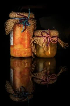 Vertical view of two small glass jars of homemade jam 스톡 사진