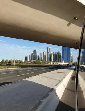 Vertical view from under a concrete overpass looking toward the skyscrapers Stock Photos