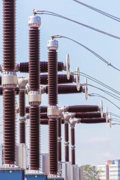 Vertical view of various elements and high-voltage insulators of a transforme Stock Photos