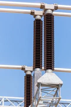 Vertical view of various elements and high-voltage insulators of a transforme Stock Photos