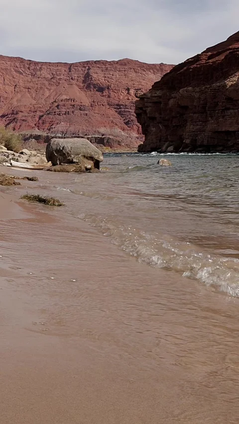 Vertical View Of Waves Breaking On A Beach Along The Colorado River In Arizona Stock Footage 306330158