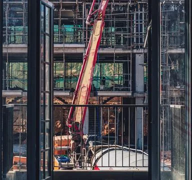 Vertical view from window. Technical modern telescopic self erection crane Stock Photos