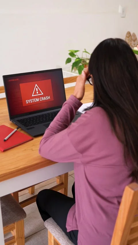Vertical View Of Woman Looking At The System Crash With A Red Screen On Laptop Stock Footage 306386145