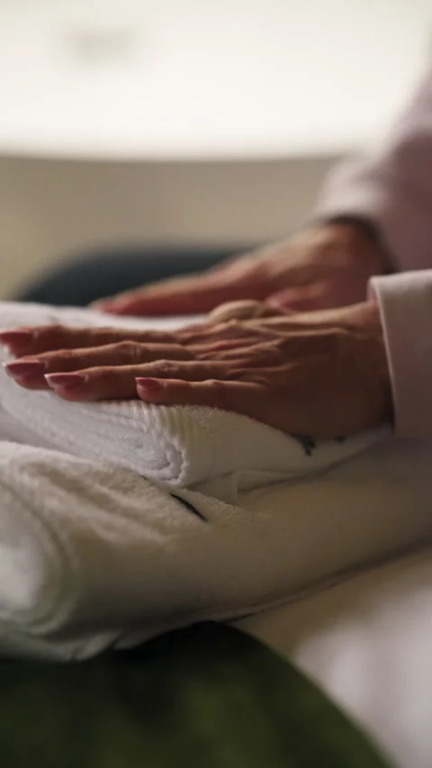 Vertical View Of A Woman's Hand Touching A Soft White Towel In A Luxury Hotel Stock Footage 332566960