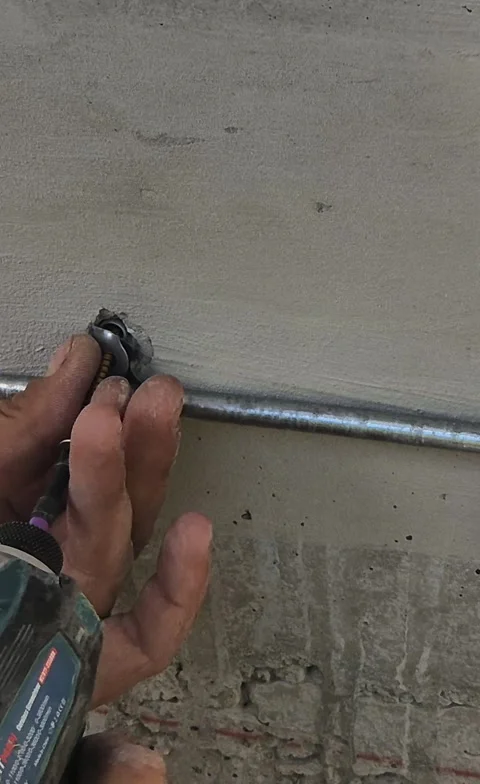 Vertical View of Worker Installing Lightning Protection on Wall Stock Footage 341104453