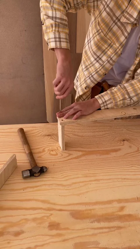Vertical view of workman with screwdriver making furniture. Stock Footage 240316340