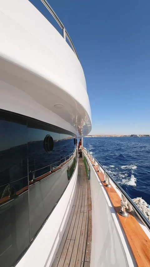 Vertical view of yacht side deck with tinted window floating in the sea Video stock 328898719