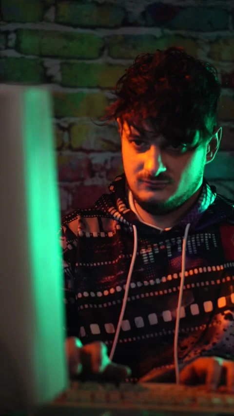 Vertical View of Young Man Working on Old PC Computer From 1990's Stock Footage 302443919
