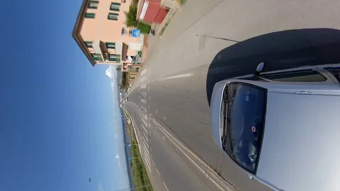 Vertical VR360 Effect Hyperlapse A car runs on a bridge on the lagoon Stock Footage 107444622