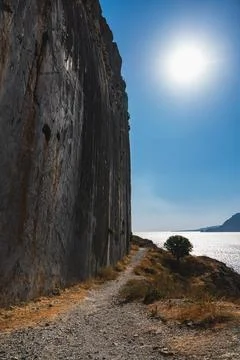 Vertical wall photographed from the bottom of a rock cliff Stock Photos