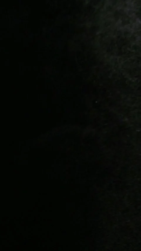 Vertical water mist spraying intermittently upward against black background. Stock-Footage 337450628